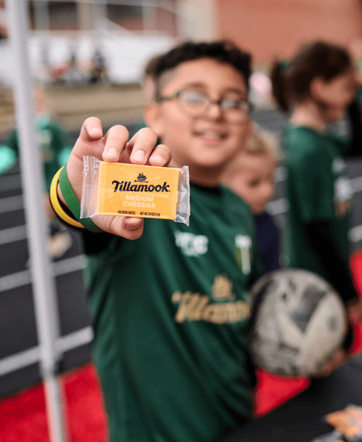 Soccer Player Holding Tillamook Snack cheese